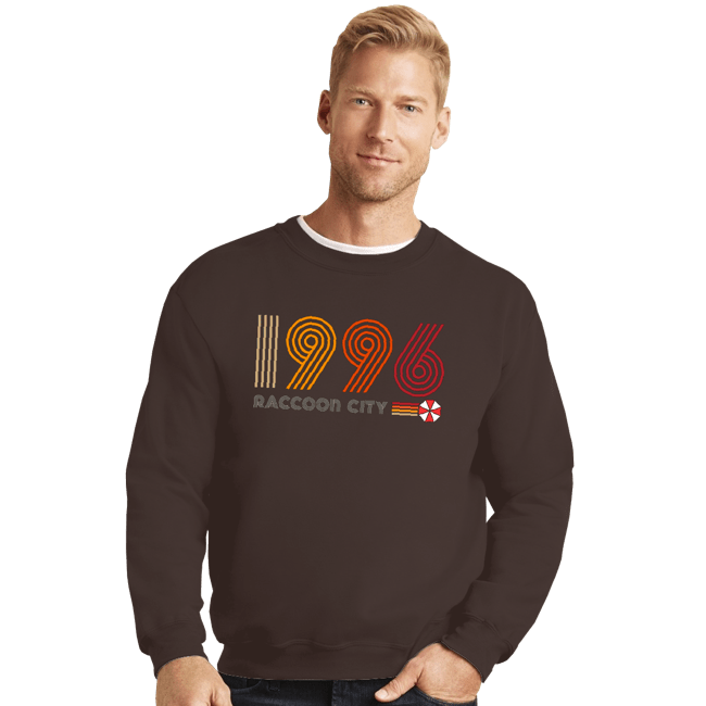 Daily_Deal_Shirts Crewneck Sweater, Unisex / Small / Dark Chocolate Raccoon City 1996